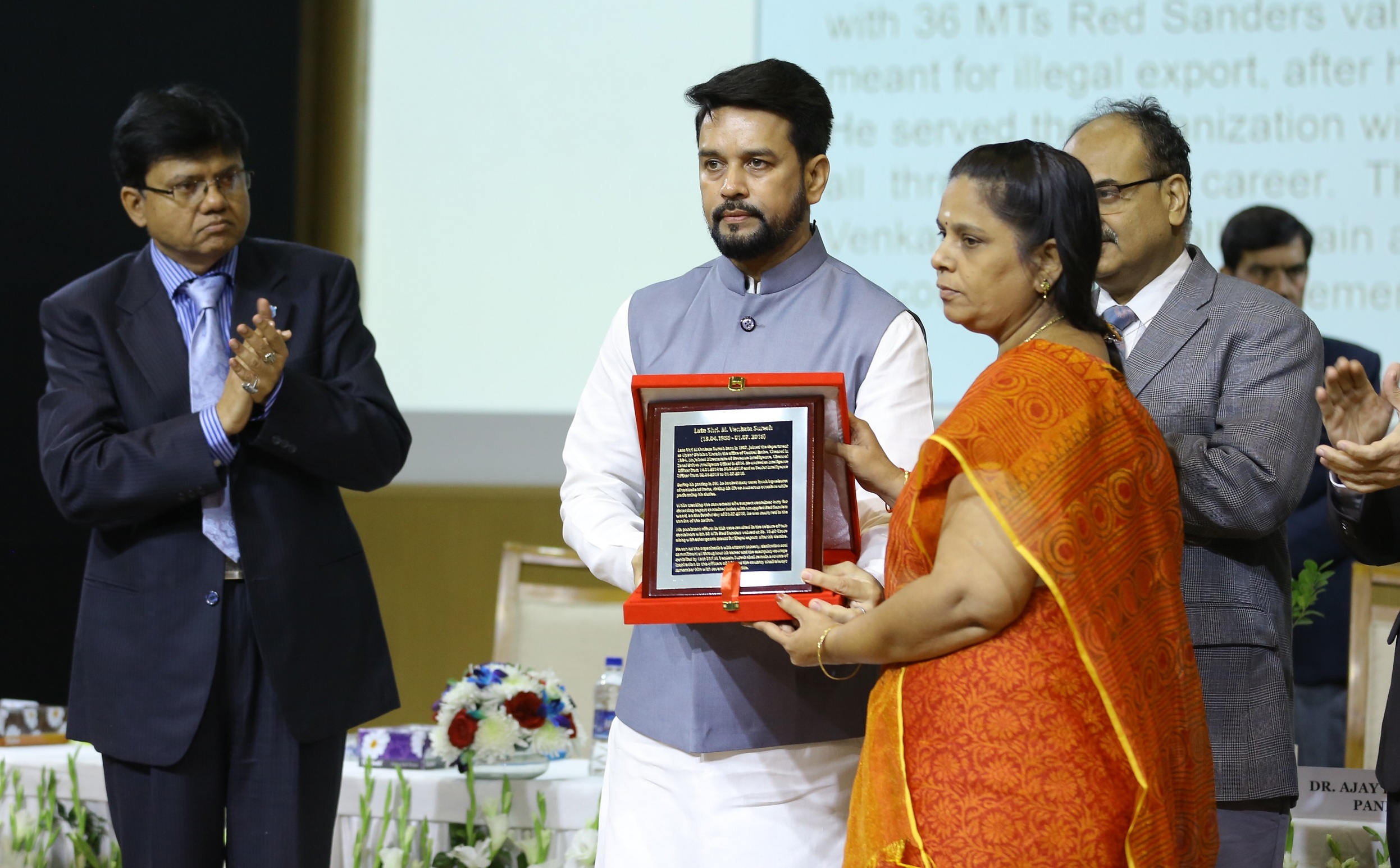 Honourable the then MoS Finance presenting DRI Martyr’s Medal to wife of Late Shri Venkata Suresh SIO DRI Chennai Zonal Unit.